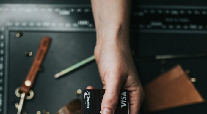 How to Enhance Sales and Negotiation Skills During Your Degree for a Successful Corporate Career Image of a transaction between 2 individuals.