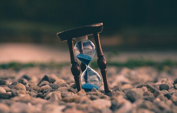 Effective Time Management Strategies for College Students image of an hourglass in the sand.
