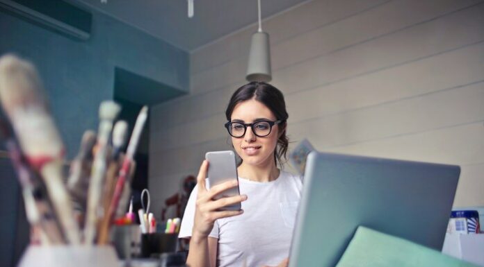 How College Students Can Maximize Their Study Time While at Work Image of a woman working and on her laptop.