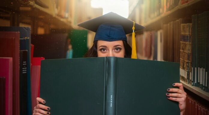 How to Structure Your Scholarship Application Essay Image of a woman with a graduation cap holding a big book.